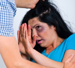 Terrified abused woman trying to stop the attack and devend herself,