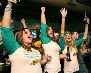 February 6, 2011 Packer Fans watch the Super Bowl from Zim's bar at 770 N. Milwaukee St. in Milwaukee. From left to right, Jennifer Sands of Milwaukee, Erinn Lobdell (cq)of Milwaukee, and Candice Winstead of Milwaukee, celebrate a Packer touchdown. MICHAEL SEARS/MSEARS@JOURNALSENTINEL.COM