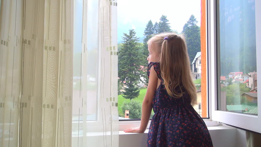 little girl looking out the window