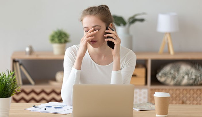 Upset girl receive bad news talking on cellphone